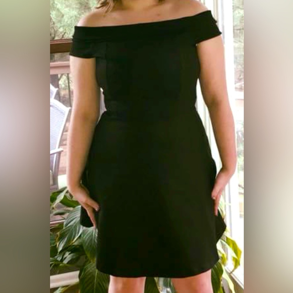 Classic black off the shoulder knit dress. Med